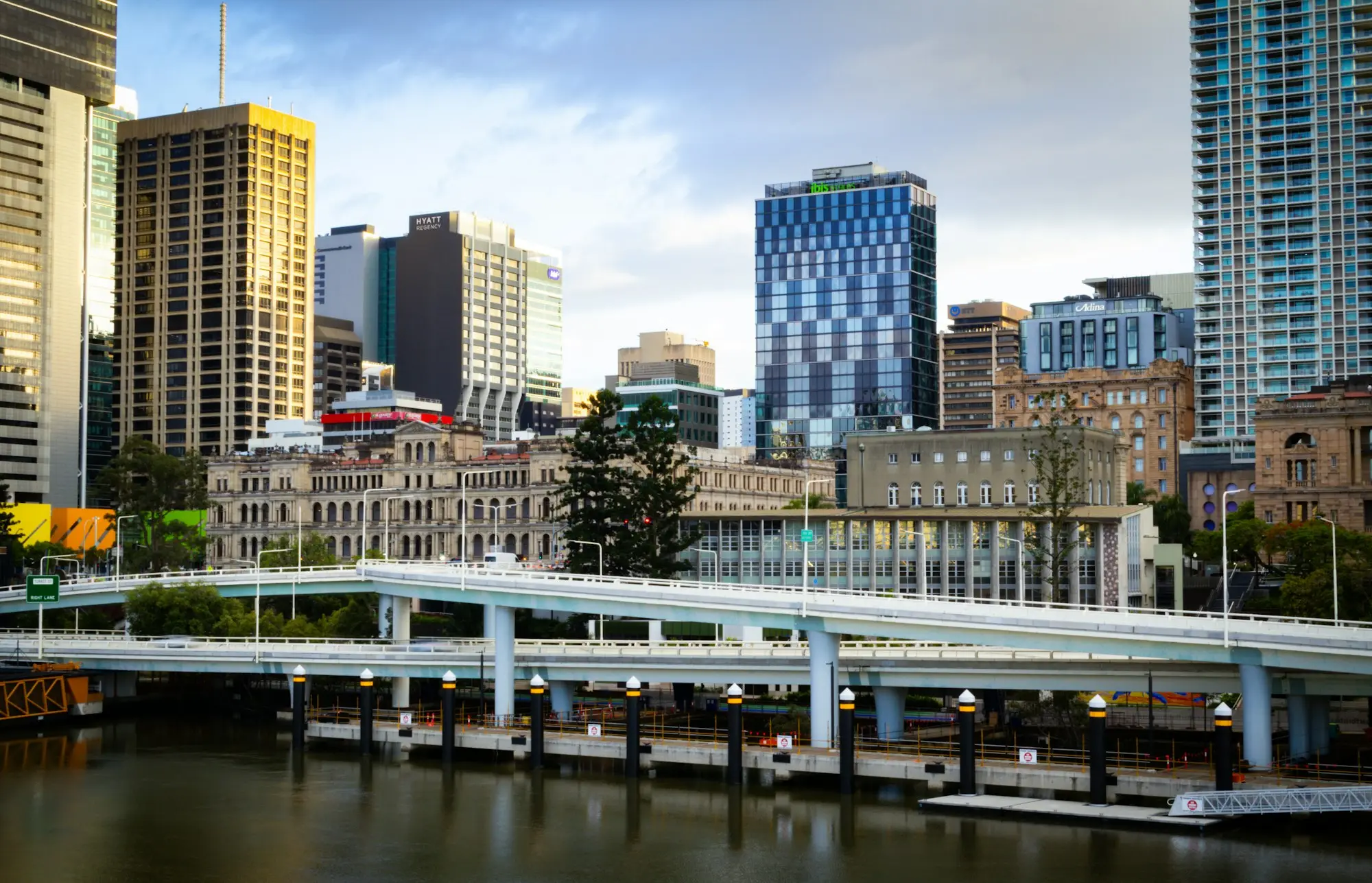 Brisbane CBD office towers and riverside expressway in late afternoon light